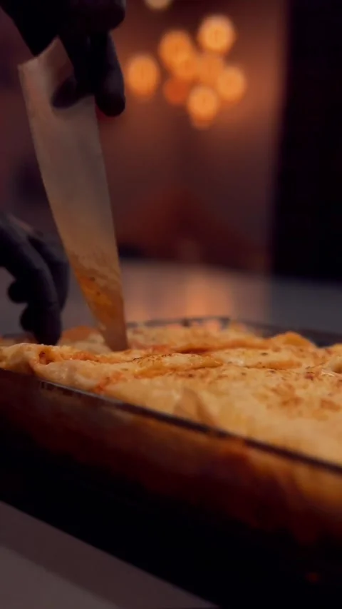Cutting lasagna with Knife Stock Footage 180436738
