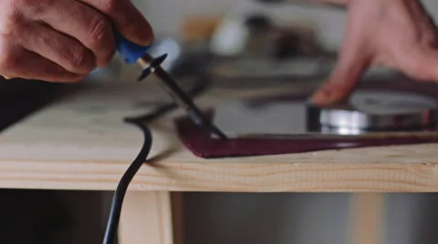 Cutting leather. Dolly shot Stock Footage 61034128