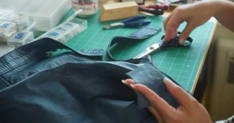 Cutting Leather Jacket with Scissors Video stock 145179514