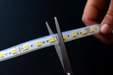 Cutting led strip with scissors,installation of a diode tape Stock-Fotos