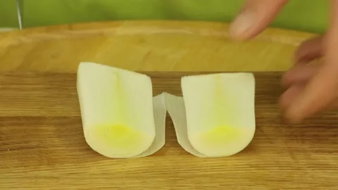 Cutting leek with a sharp knife Stock Footage 186666028