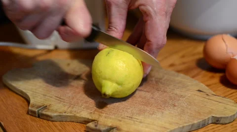 Cutting lemon on a board and squeezing in cake mixture. 스톡 동영상 44251398