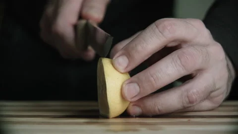 Cutting lemon on a cutting board Stock Footage 132217272