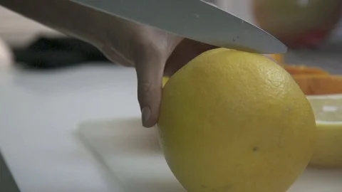 Cutting lemon in Kitchen Stock Footage 72357583