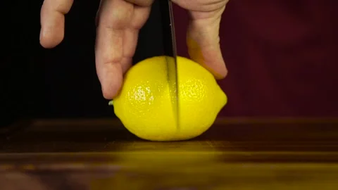 Cutting a Lemon with a Knife Stock Footage 243605106