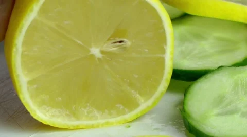 Cutting Lemon with knife in the kitchen Stock Footage 68036384