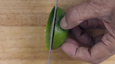 Cutting lemon into pieces Stock Footage 253053446