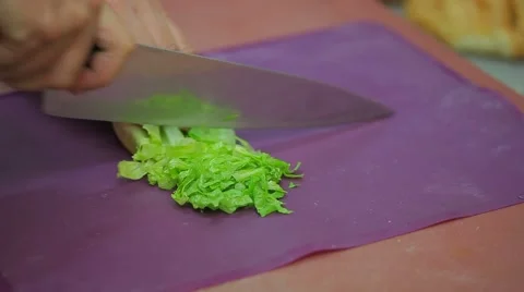 Cutting lettuce to prepared salad Stock Footage 56632259