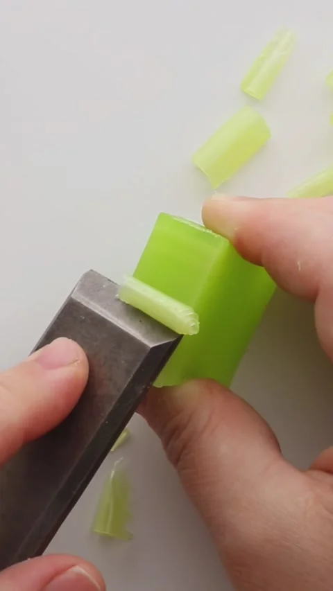Cutting light green soap, creating graceful curls. Stock Footage 310517468
