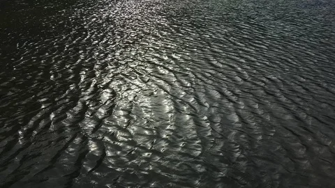 Cutting light on the water surface Stock Footage 123233711