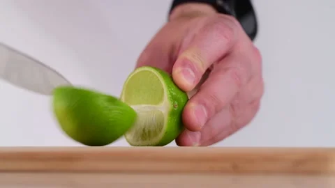 Cutting Lime on Chopping Board Video stock 133629313