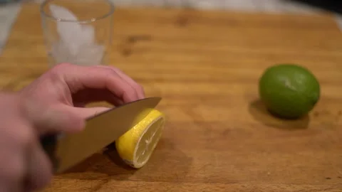 Cutting lime, lime water, lemon water, cutting lemon, cutting board, Stock Footage 262181374