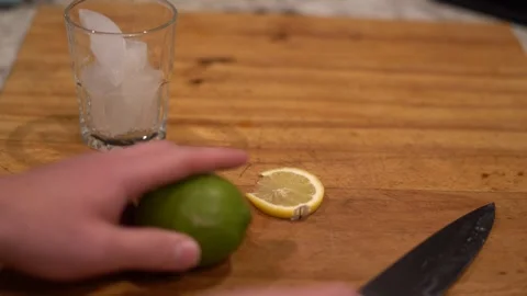 Cutting lime, lime water, lemon water, cutting lemon, cutting board, Stock Footage 262181382