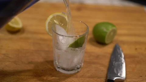 Cutting lime, lime water, lemon water, cutting lemon, cutting board, Stock Footage 262181665