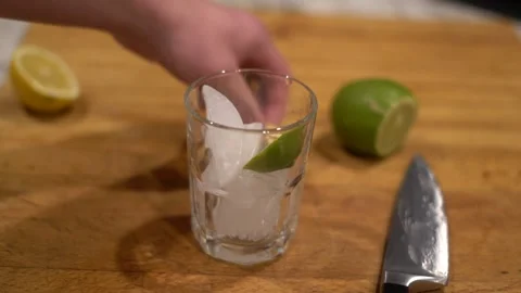 Cutting lime, lime water, lemon water, cutting lemon, cutting board, Stock Footage 262181769