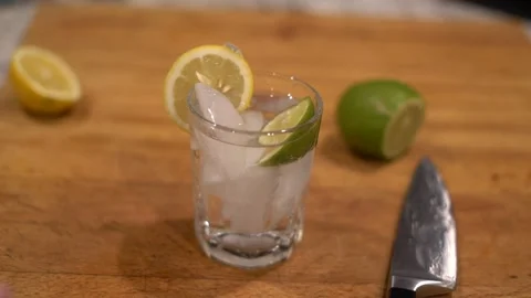 Cutting lime, lime water, lemon water, cutting lemon, cutting board, Stock Footage 262181771
