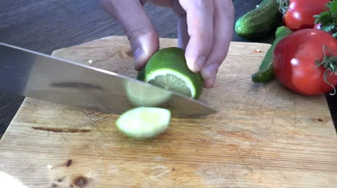 Cutting a lime in quarters Stock Footage 48136993
