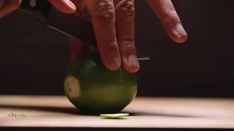 Cutting limes in slow motion Stock Footage 83862813