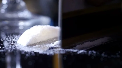 Cutting lines of cocaine, tracking Stock Footage 77535743