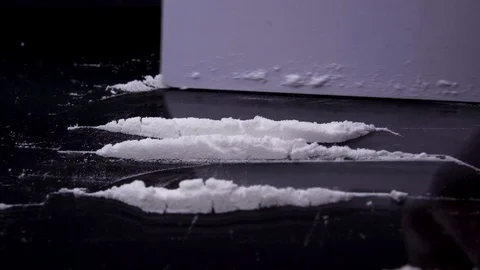 Cutting lines of cocaine, tracking Stock Footage 128806018