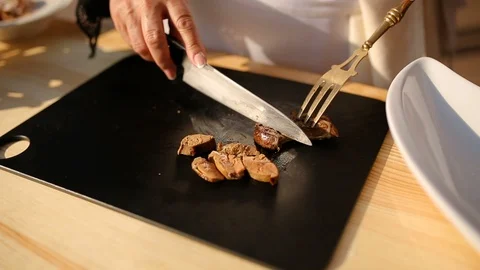 Cutting a liver on a cutting board, close-up Stock Footage 91268452
