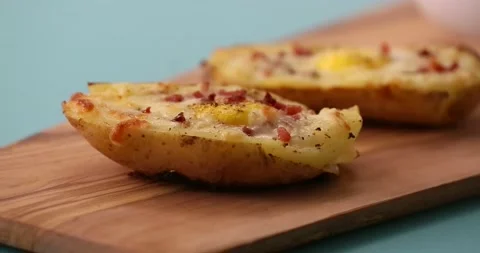 Cutting loaded potato in half 2 Stock Footage 132149165