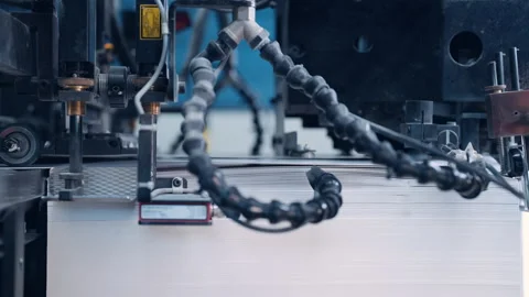 A cutting machine cuts a large pile of paper in a printing house. Stock Footage 197462899