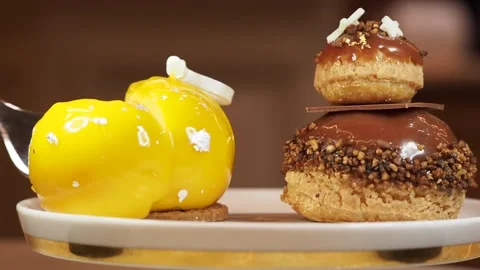 Cutting Into A MANGO AND KEFFIR LIME XMAS BUBBLE, Afternoon Tea, London Stock Footage 296038605