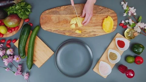 Cutting mango fruit on a cutting board Stock Footage 249079484