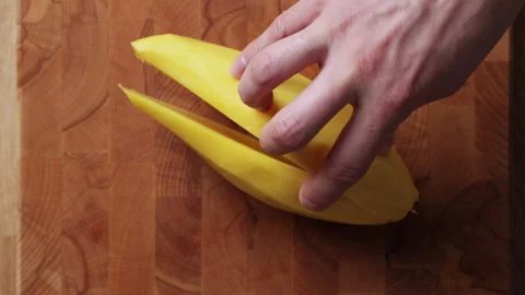 Cutting Mango In Half Top View Видео 335081452