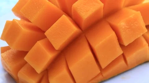 Cutting mango on a plate Stock Footage 50719828
