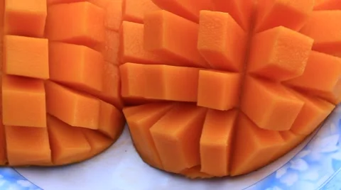 Cutting mango on a plate Stock Footage 50749787