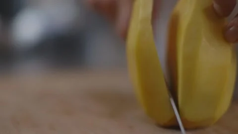 Cutting mango into slices with a knife Stock Footage 194478549