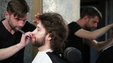 Cutting man's beard with the straight razor Video stock 62978512