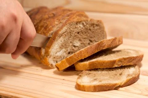 Cutting marble Wheat - rye bread on a wooden board Stock Photos