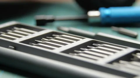 Cutting mat with screwdrivers on table near radio control model Video stock 147404726