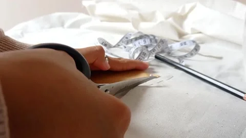 Cutting the material for a mask in daily use Stock Footage 149708855