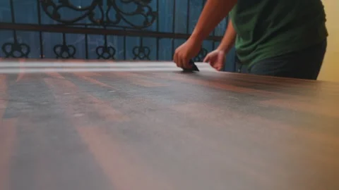 Cutting Material on a Wooden Table Stock Footage 312503928