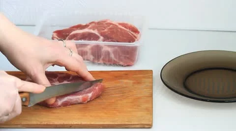 Cutting meat Stock Footage 21456820