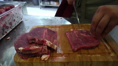 Cutting Meat Stock Footage 116736311