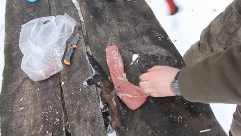 Cutting meat with the machete Stock Footage 74610498