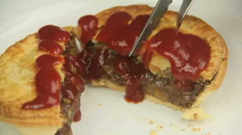 Cutting Meat Pie With Ketchup Stock Footage 39441954