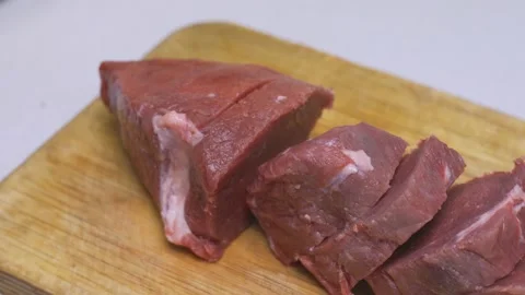 Cutting meat into pieces Stock Footage 132445478