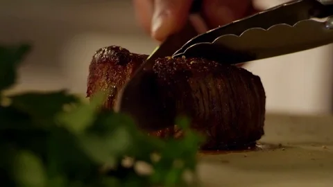 Cutting meat in slow motion Stock Footage 73605454