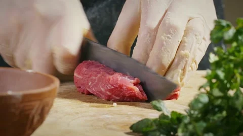 Cutting meat on wooden table Stock Footage 138126151