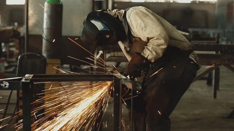 CUTTING METAL WITH ANGLE GRINDER Stock Footage 306691803