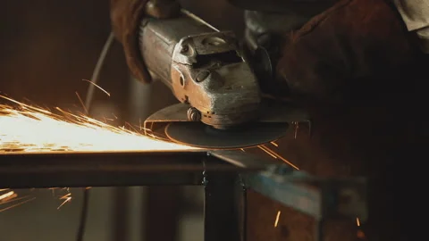 CUTTING METAL WITH ANGLE GRINDER Stock Footage 306691820