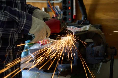 Cutting metal with an angle grinder Stock Photos