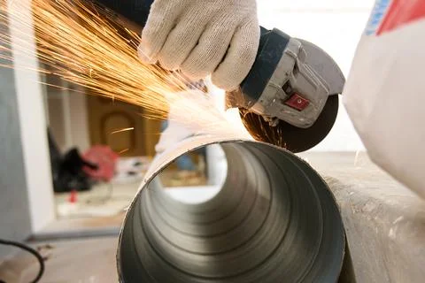 Cutting metal with an angle grinder Stock Photos