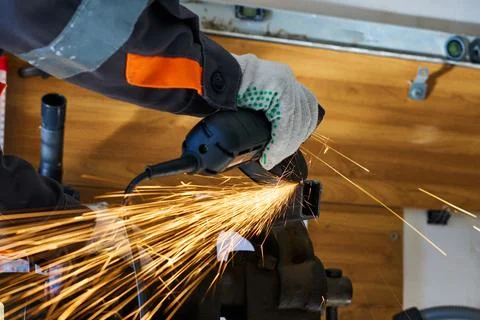 Cutting metal with an angle grinder Stock Photos